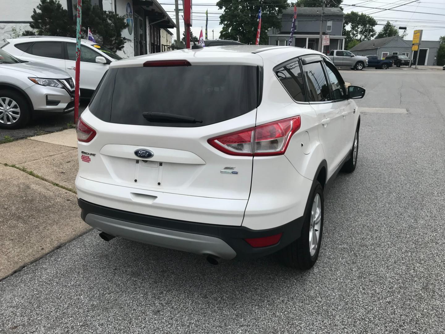 2016 White /Gray Ford Escape SE (1FMCU9GX9GU) with an 1.6 V4 engine, Automatic transmission, located at 577 Chester Pike, Prospect Park, PA, 19076, (610) 237-1015, 39.886154, -75.302338 - 2016 Ford Escape SE: Only 135k miles, 4x4, SUPER CLEAN, runs LIKE NEW! This vehicle comes inspected and has been given a bumper to bumper safety check. It is very clean, reliable, and well maintained. We offer a unique pay plan that is known for being the easiest and fastest financing option in t - Photo#6